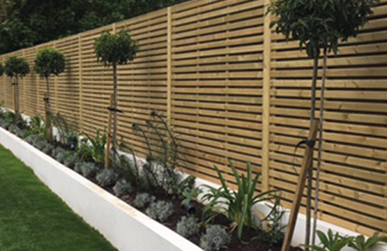 Timber garden fence installation with Coastline workwear